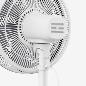 White oscillating wall fan on a white background